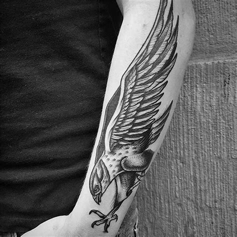 minimalist hawk tattoo|hawk arm tattoo.